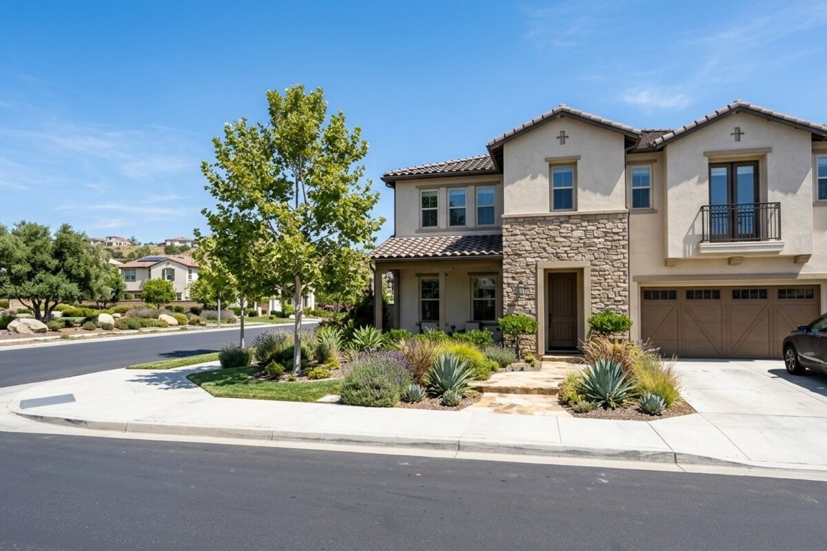 Modern single-family home in a Carlsbad master-planned community with manicured landscaping and HOA-maintained common